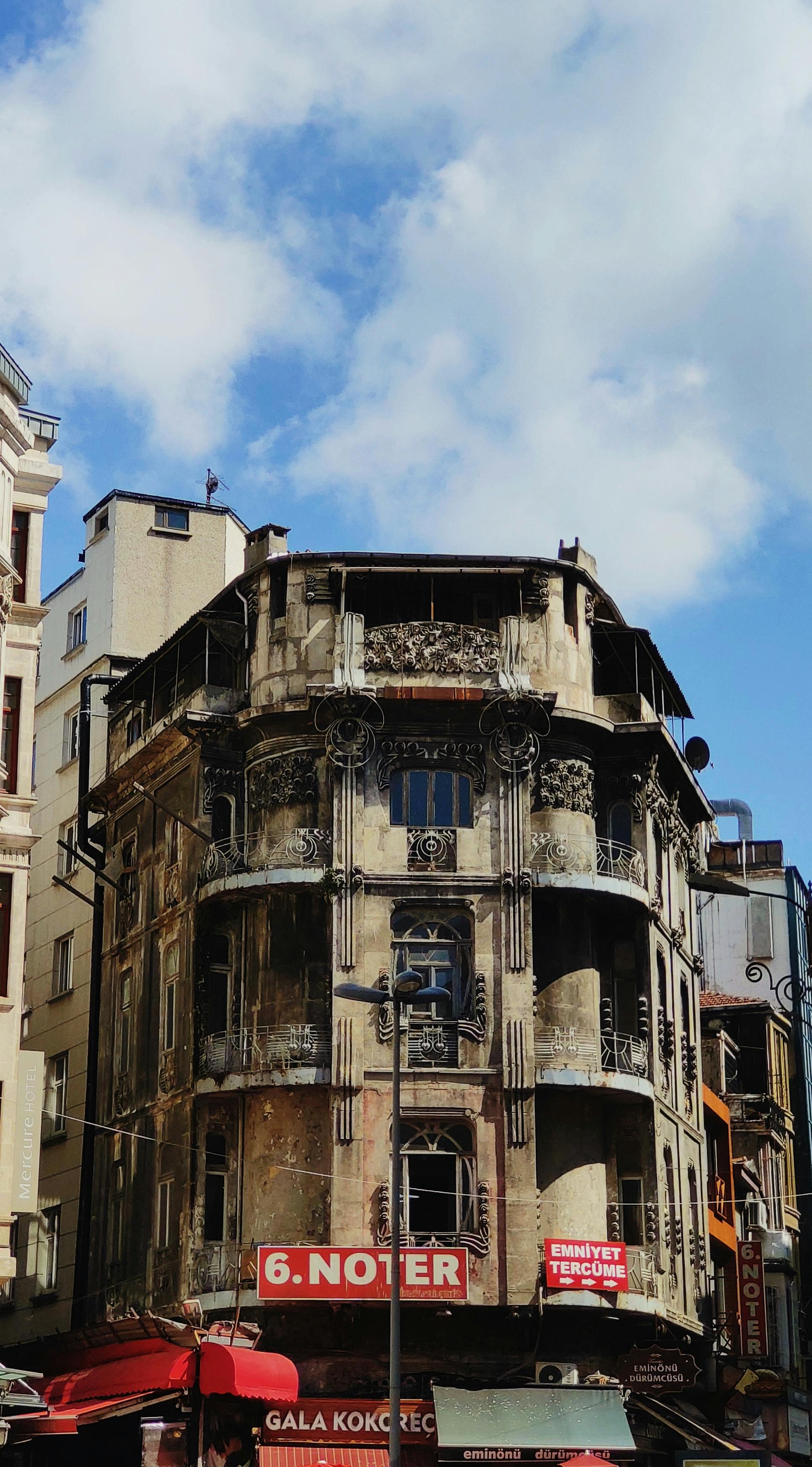 Historic building in Fatih, Istanbul, showcasing unique architectural design under a bright blue sky.