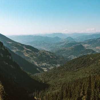 A breathtaking aerial view of the lush mountains and valleys in Borșa, Romania.