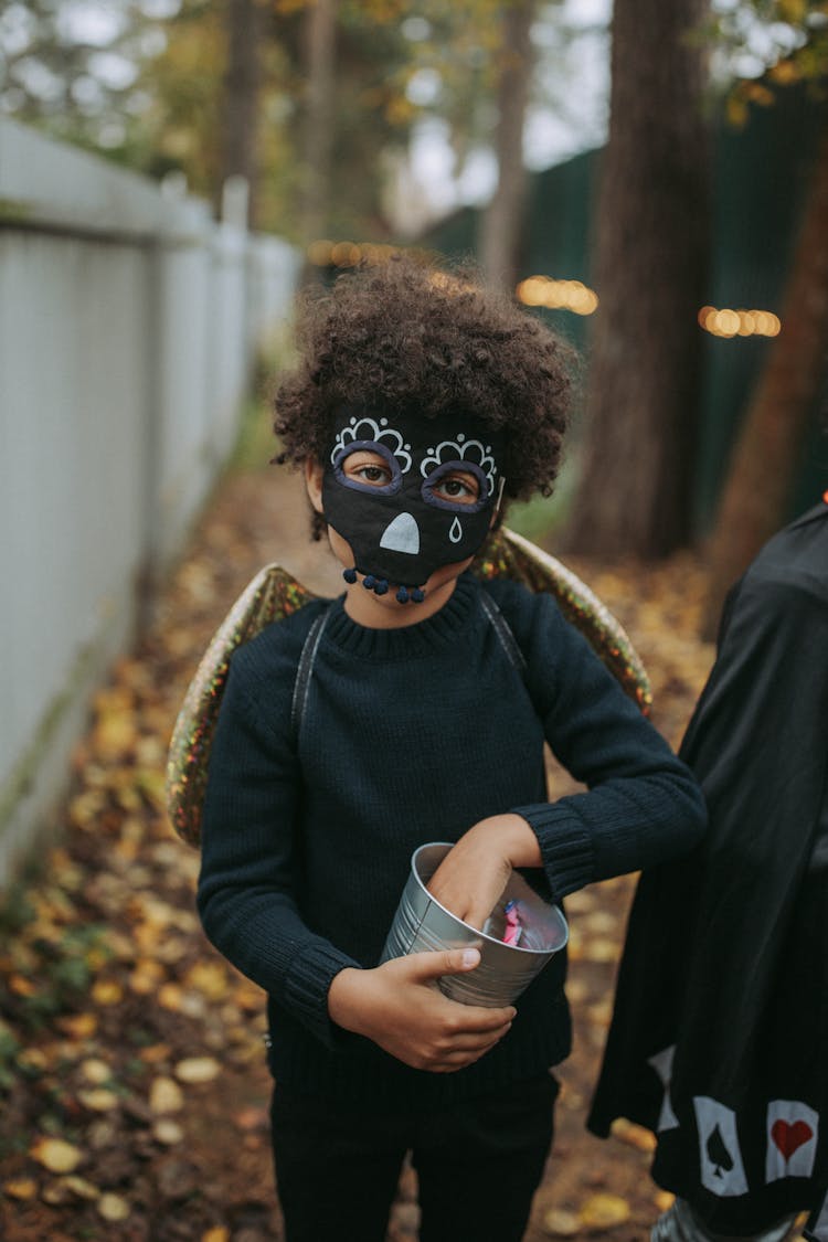 Kid Wearing Black Face Mask For Halloween