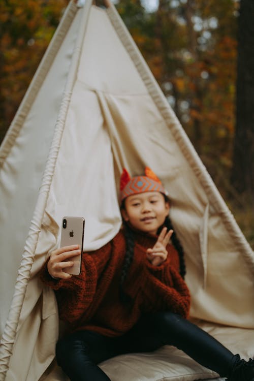 A Young Girl Taking Selfie using a Smartphone