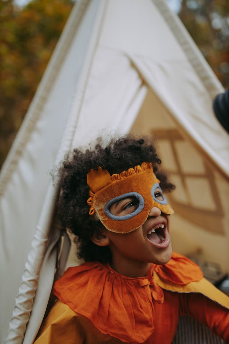 A Child Wearing A Mask On Face