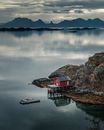 Red Wooden House Near Body of Water