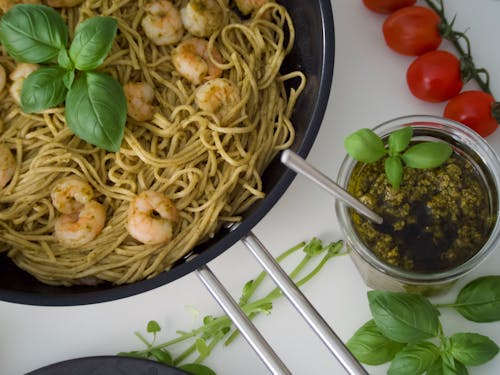 Free Shrimp Pasta Dish With Pesto Sauce Stock Photo
