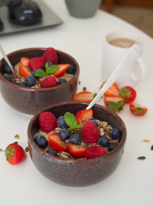 Free Ceramic Bowls with Cooked Cereals and Berry Fruits Stock Photo