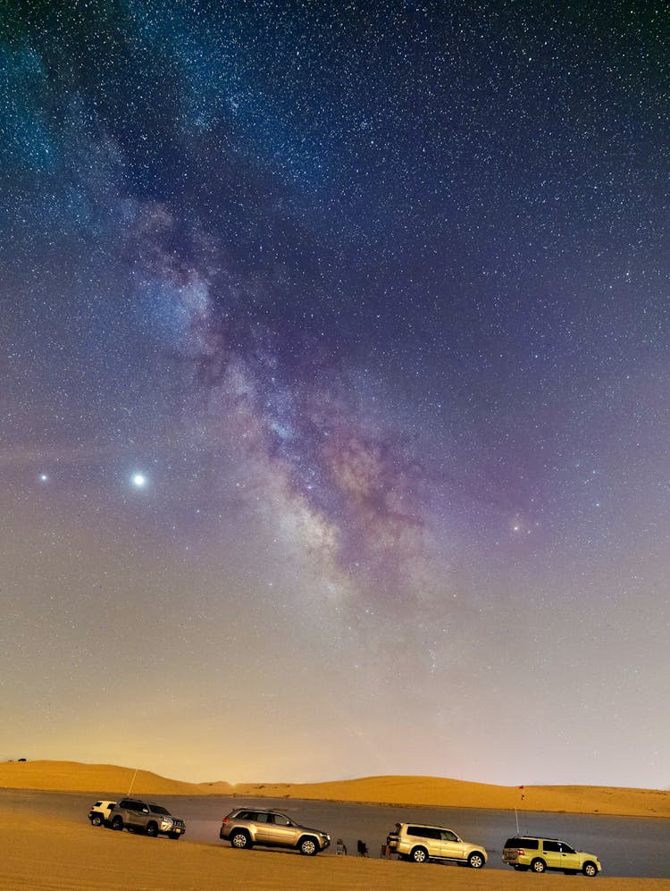 Modern Cars Under Sky With Milky Way