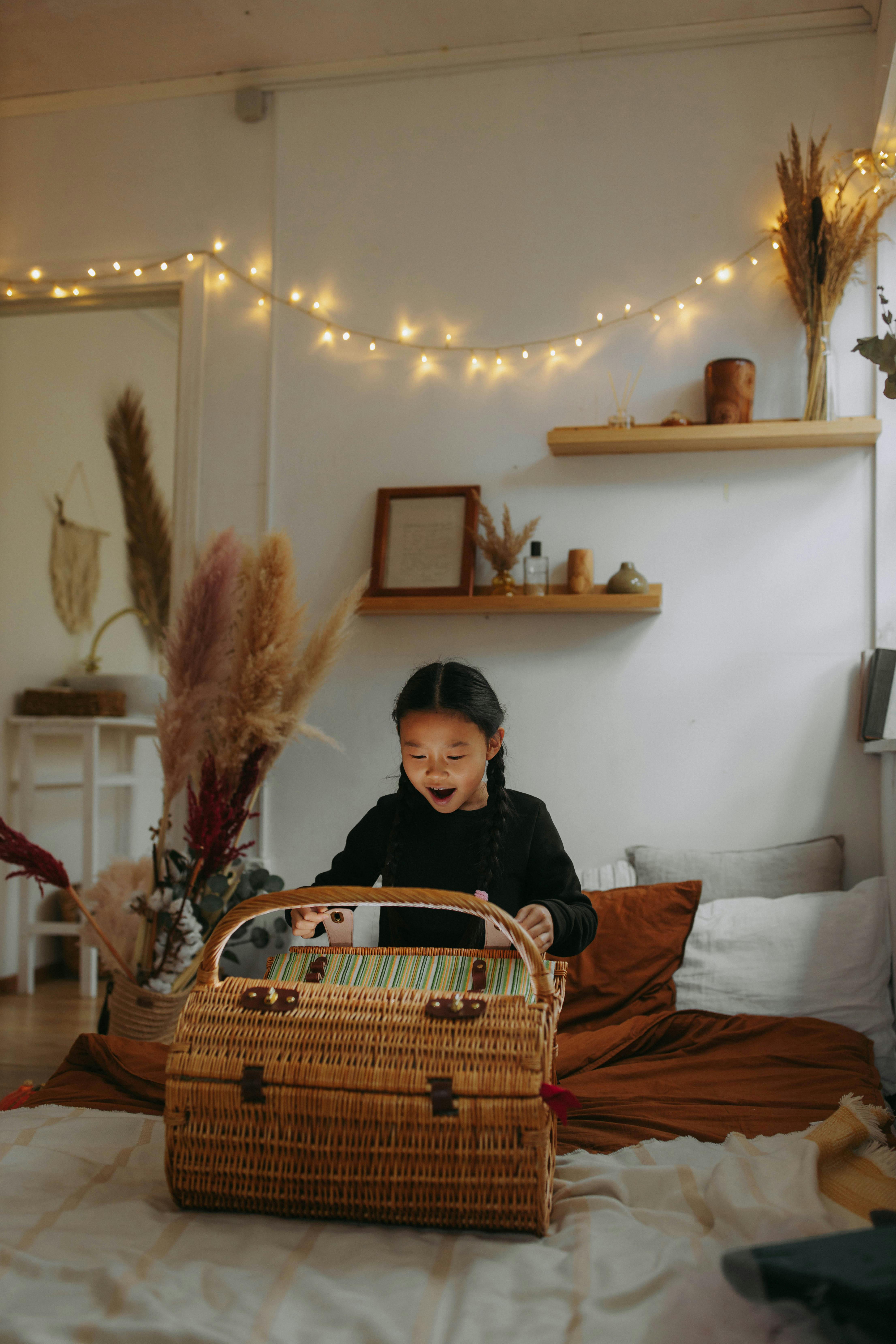 woman in black jacket sitting on brown wooden framed red padded couch