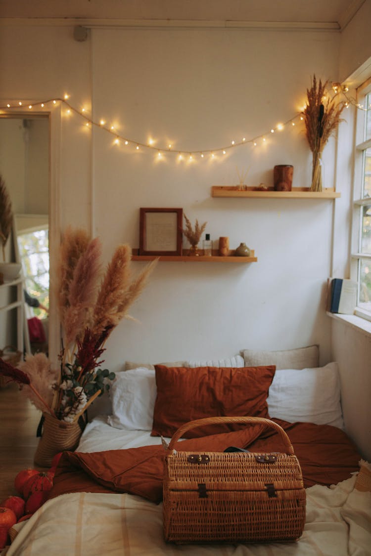 Brown Wicker Basket On The Bed