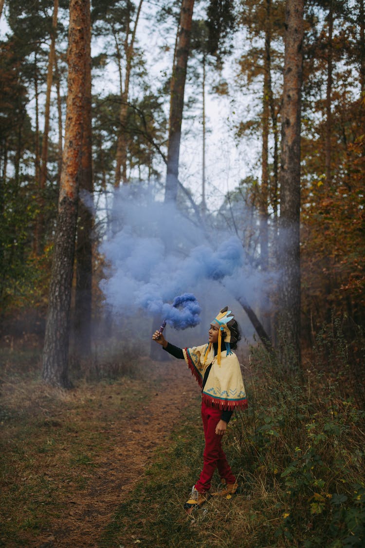 A Girl Holding A Smoke Grenade