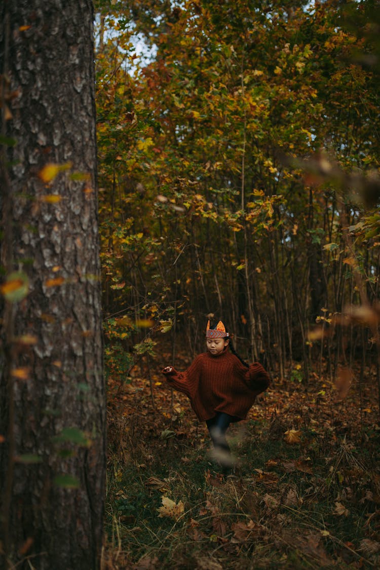 Girl In A Traditional Costume Running On A Forest 