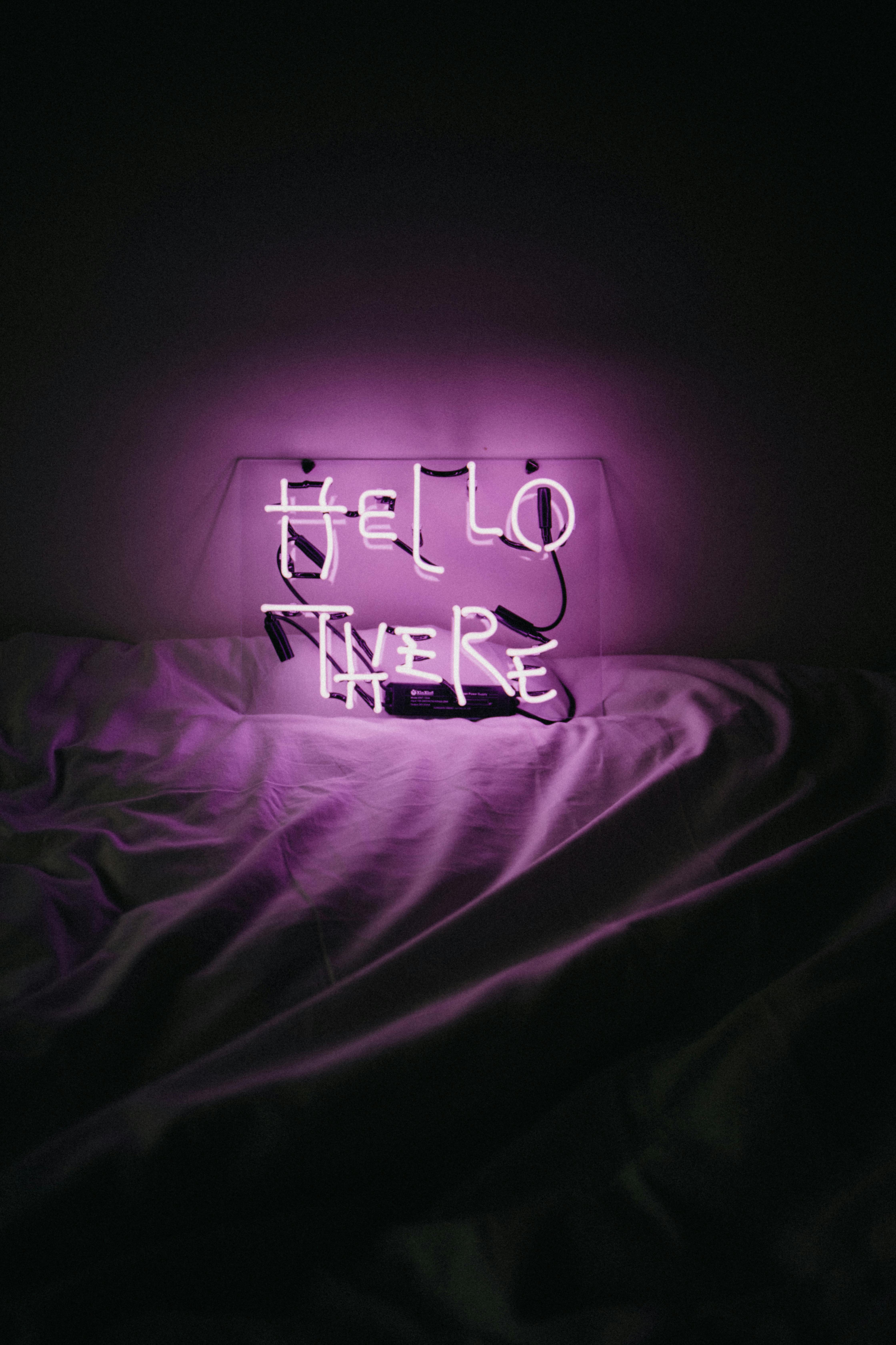 Purple Neon Sign Hello There Left in Bed · Free Stock Photo