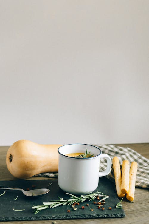 Free Pumpkin Soup in a Cup and Breadsticks Stock Photo