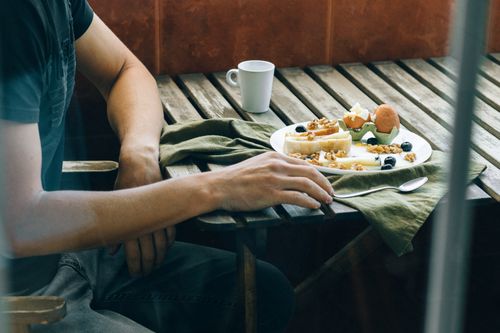 Free Inviting brunch table with fresh ingredients, coffee, and cozy ambiance. Stock Photo