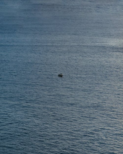 Drone Shot of a Boat Sailing on Ocean