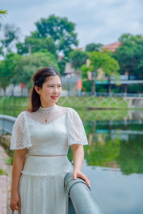 A Woman Standing on a Bridge