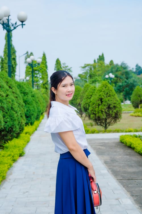 Portrait of a Woman Standing in a Park