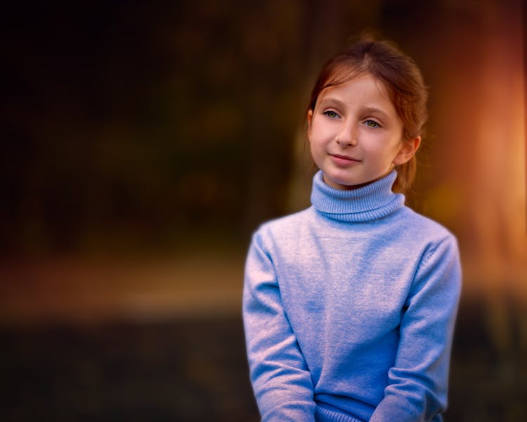 Cute Little Girl In Warm Turtleneck In Nature