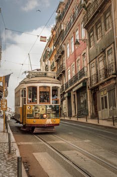 Vintage tram traversing the picturesque streets of Lisbon, Portugal.