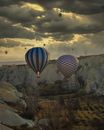 Air balloons under bright cloudy sky