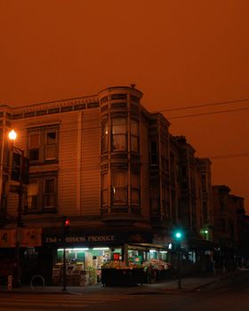Mission District building with iconic bay windows at twilight in San Francisco.