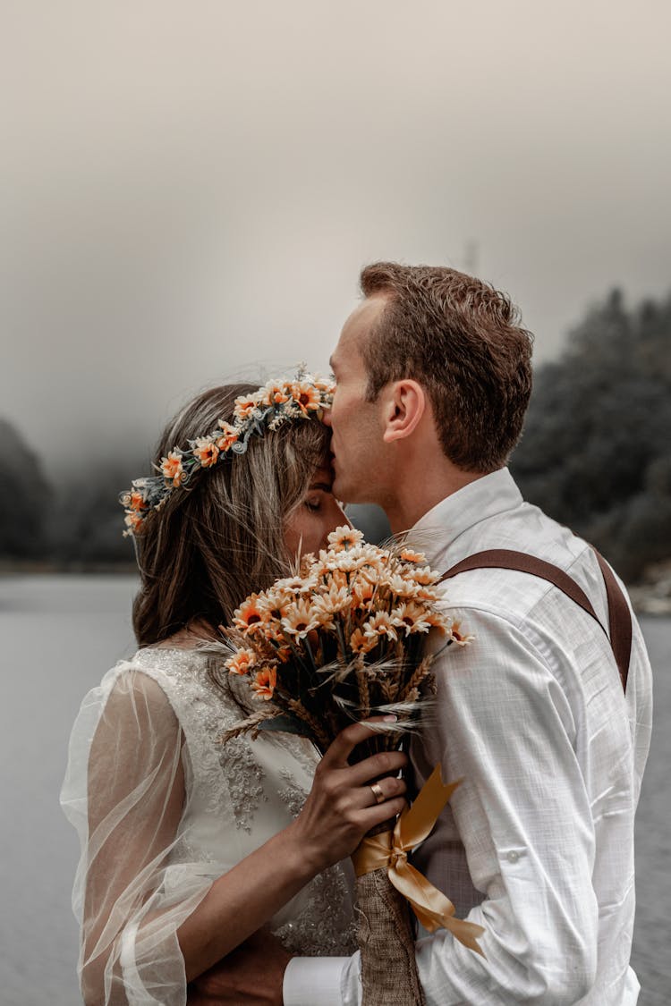 Loving Couple Embracing On Riverside