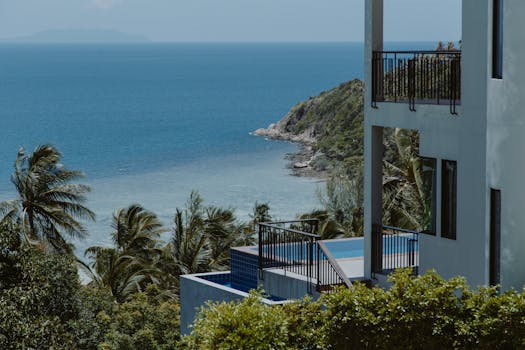 Stunning ocean view from a tropical resort balcony, perfect for a summer vacation.