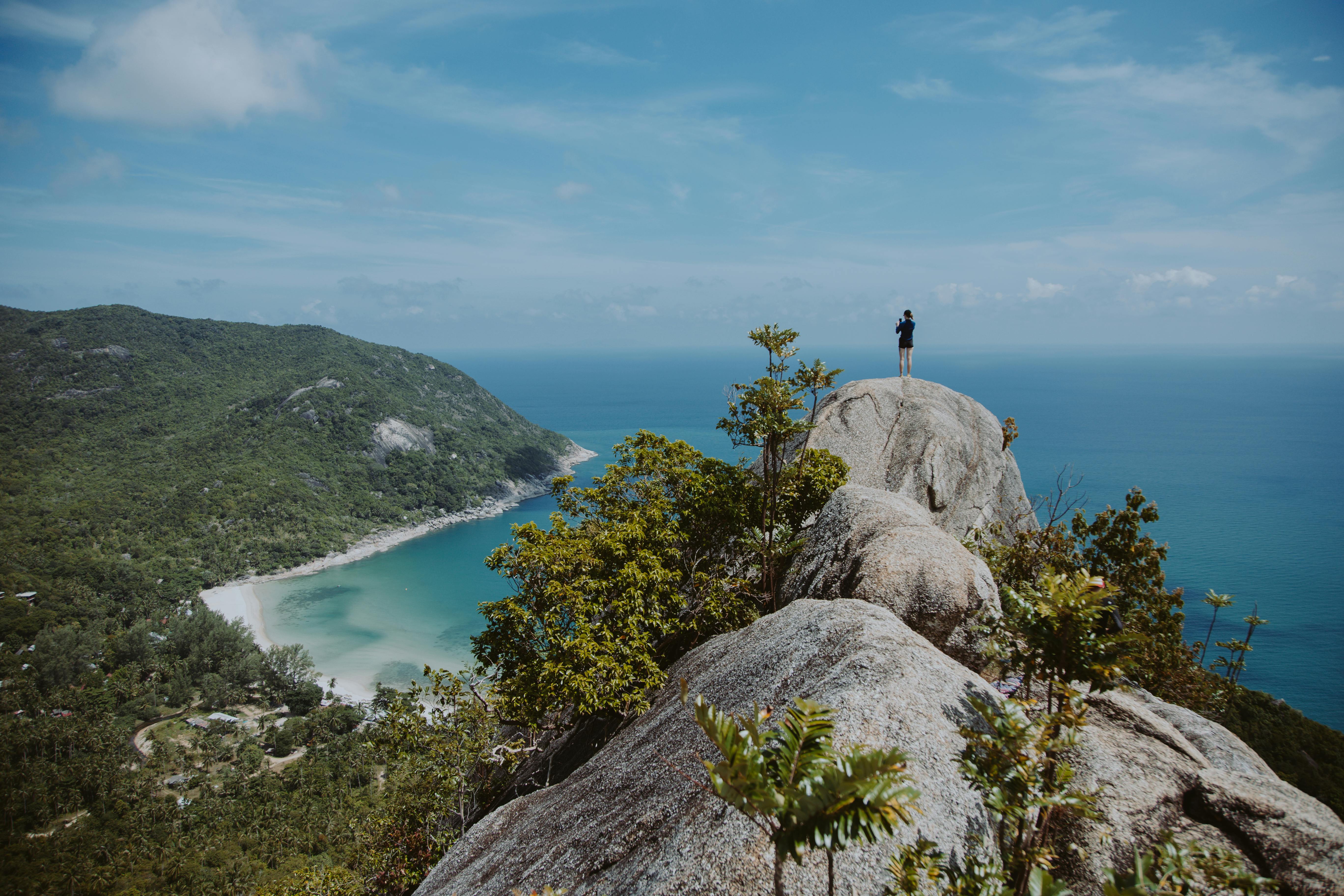 a person standing on the rocky mountain