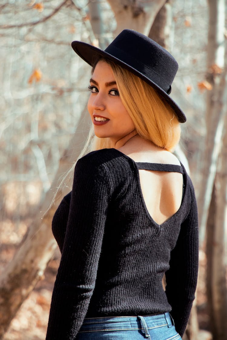 Woman In Black Knit Sweater And Black Hat