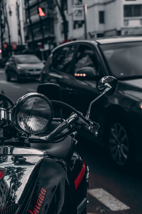 Free Close-up of a motorcycle and cars on a busy street in Rabat, Morocco, highlighting urban life. Stock Photo