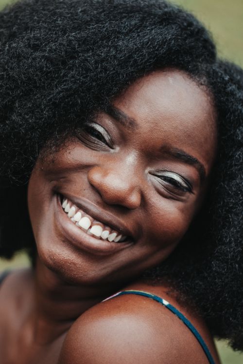 Smiling woman with full natural afro hair