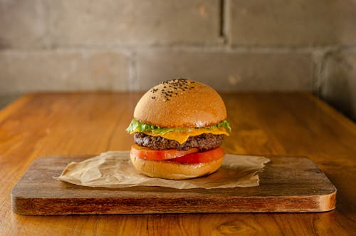 Free A Burger on the Wooden Chopping Board Stock Photo