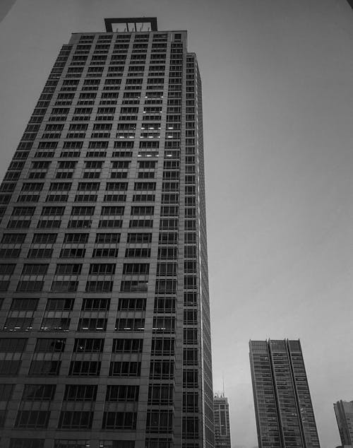Free Grayscale Photo of a High Rise Building Stock Photo