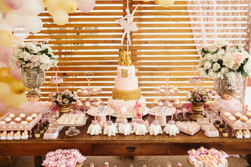 Birthday party table setup with cake and celebration decorations