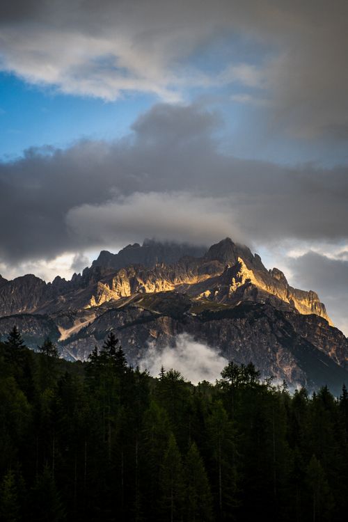 Free Stunning view of Dolomites in Italy with dramatic clouds at sunset. Alpine scenery. Stock Photo