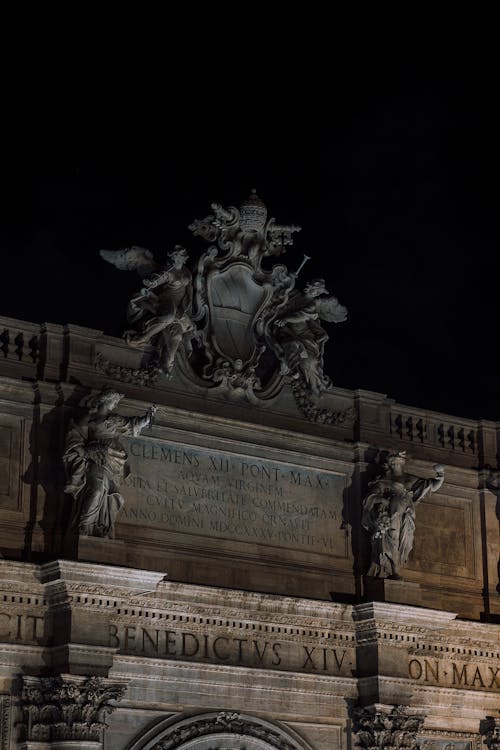 Gray Concrete Statue during Night Time