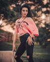 Free Woman in Pink Long Sleeve Shirt and Black Pants Stock Photo