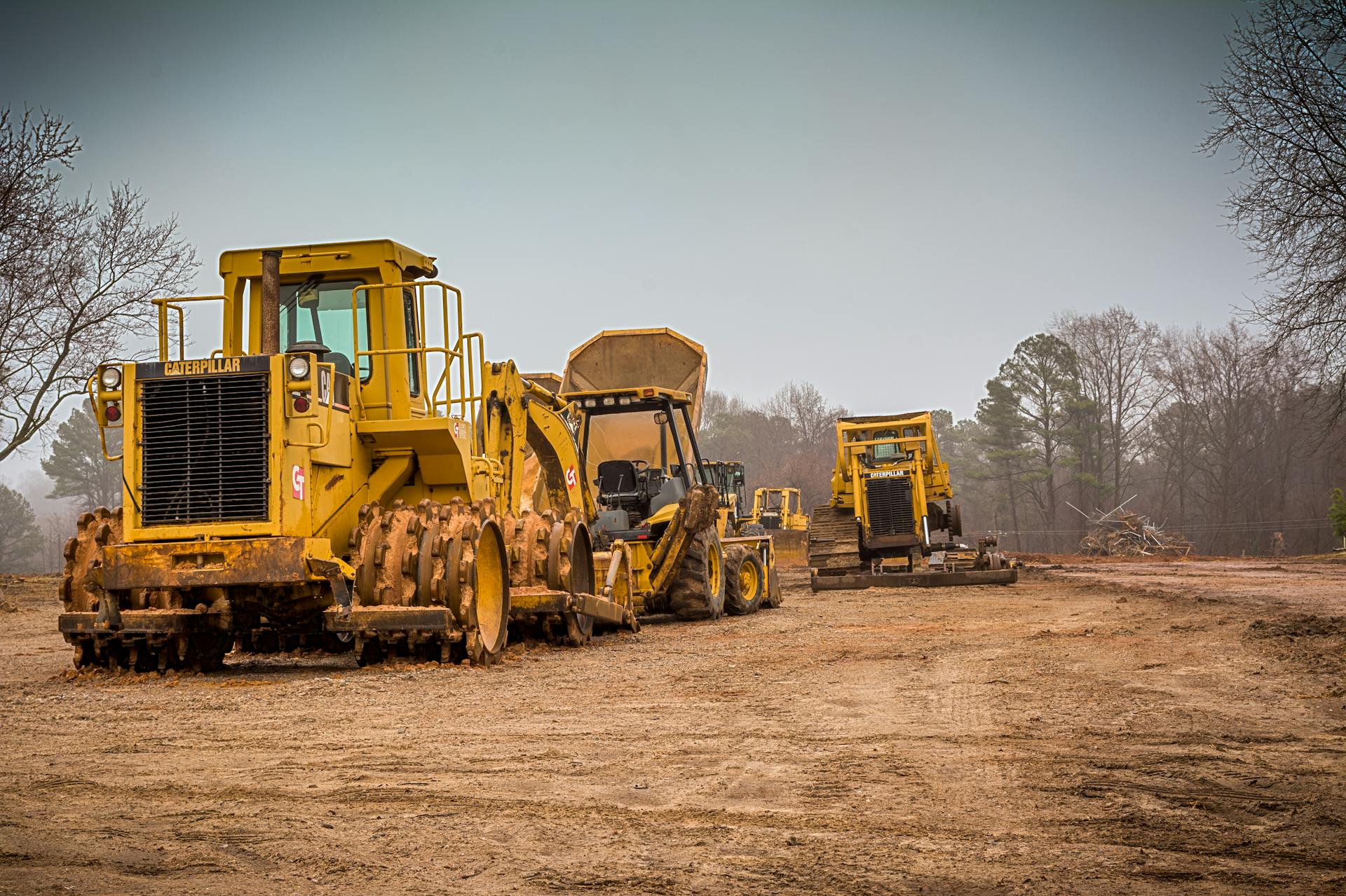 Yellow and Black Heavy Equipment on Brown Field