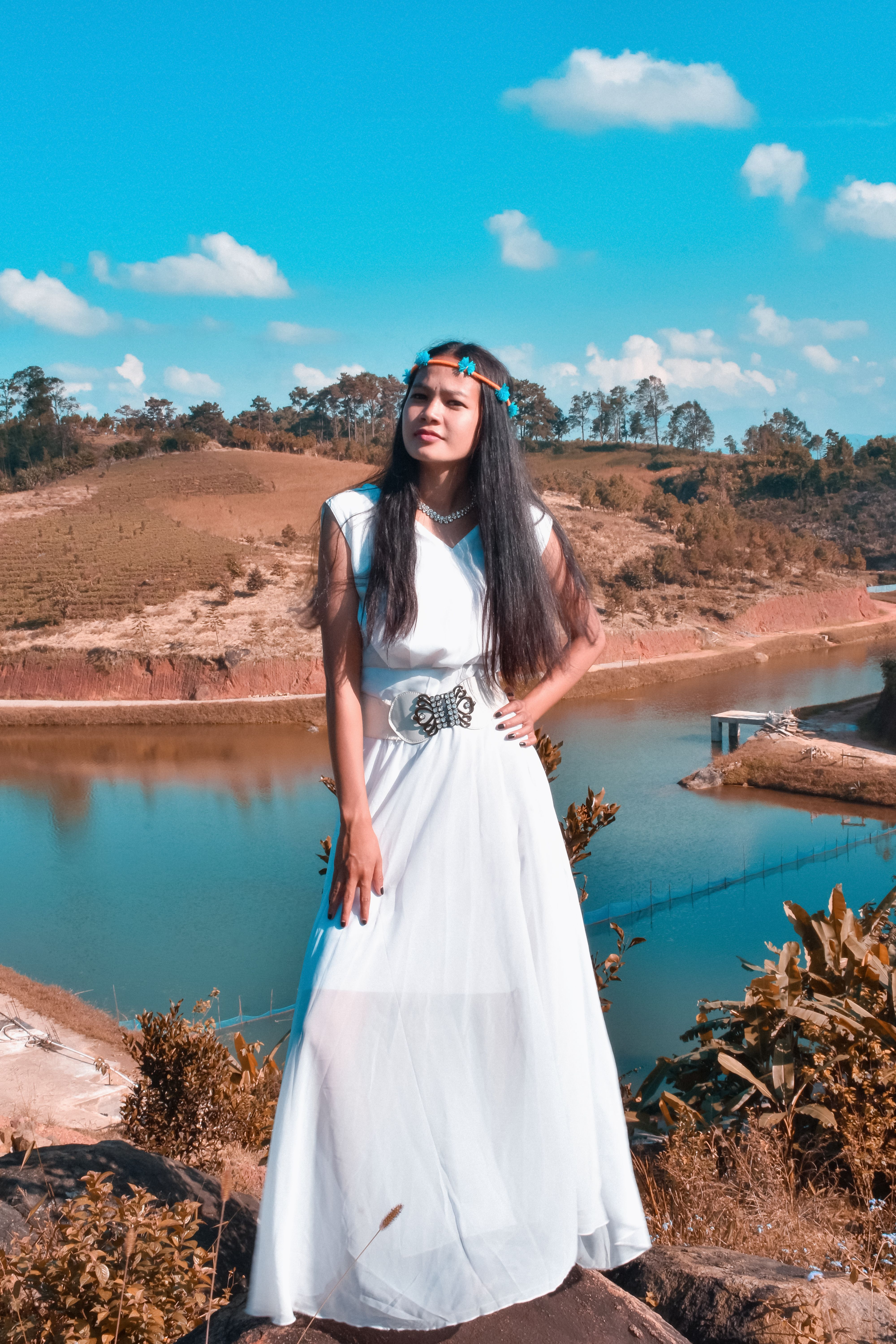 Woman in White Sleeveless Dress Standing Near A River · Free Stock Photo