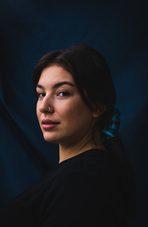 Woman Wearing Black Shirt with Ponytail