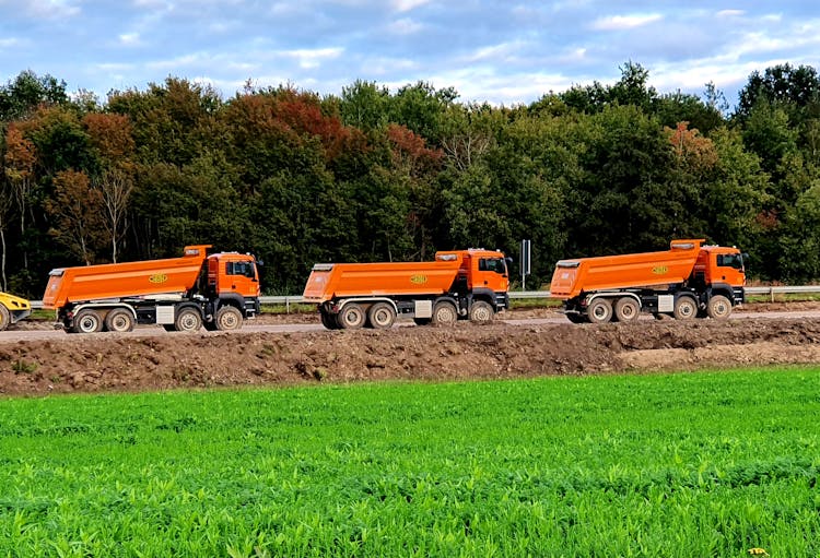 Dump Trucks Parked On The Road