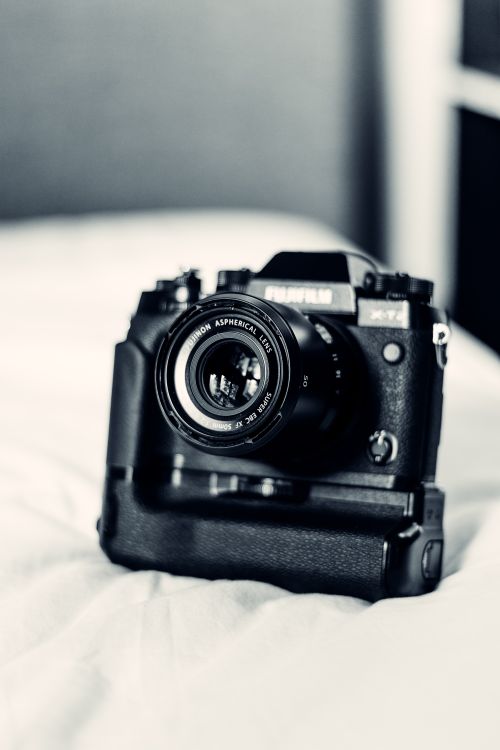 Free Black and white of small contemporary compact photo camera in bright room in daytime Stock Photo
