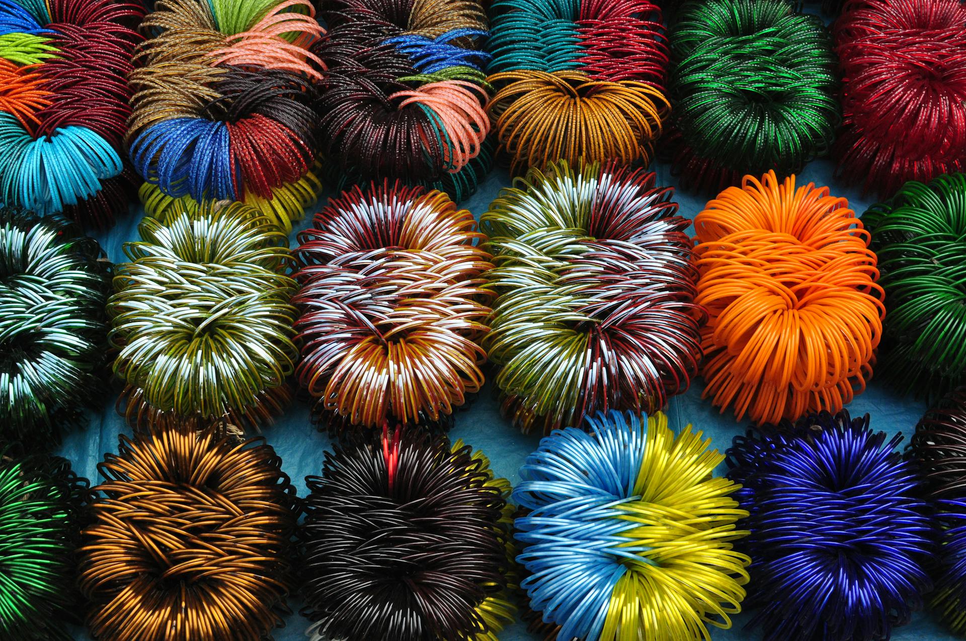 Vibrant and colorful coiled wires arranged in a captivating pattern on display.