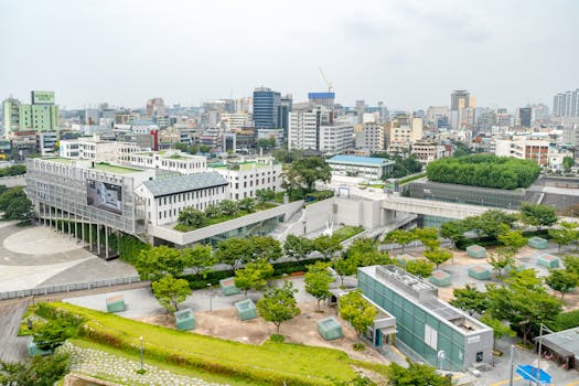 Aerial view of Gwangju cityscape showcasing modern architecture and green spaces.