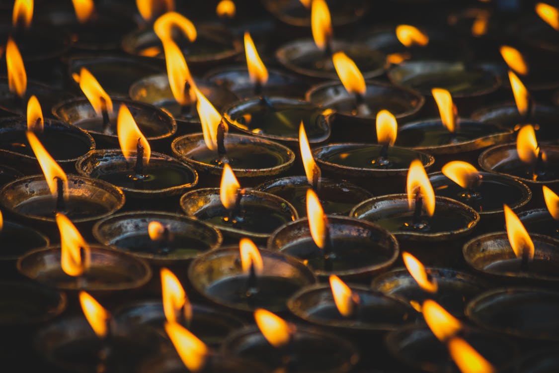 Free Lighted Candles in Close Up Photography Stock Photo