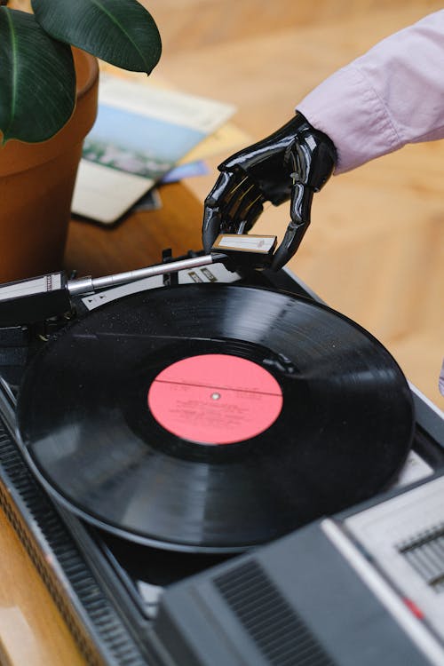 Black Vinyl Record Player on Brown Wooden Table