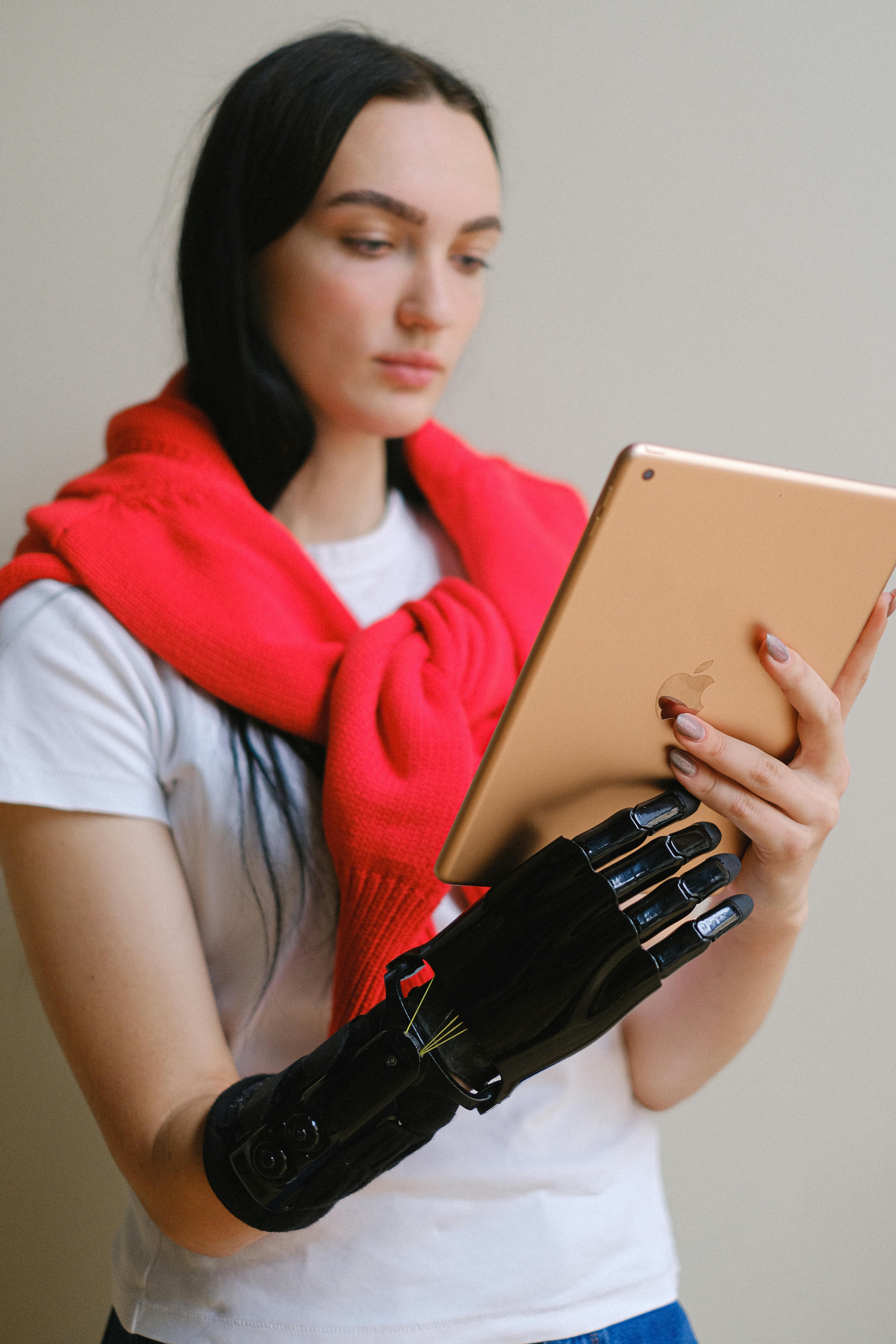 a woman holding a digital tablet