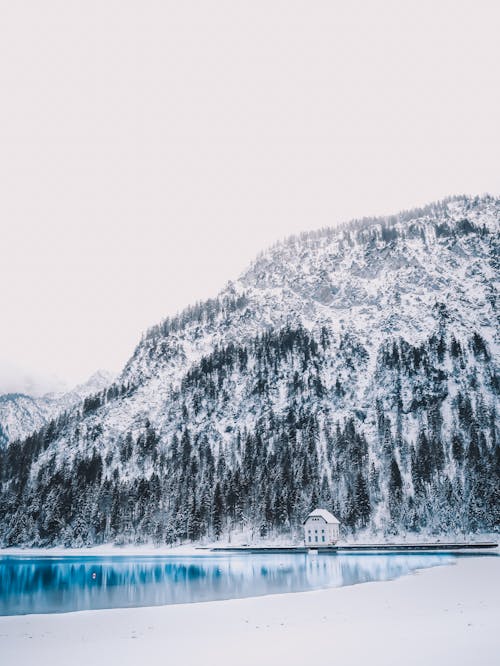 White Sky over a Mountain and a Lake