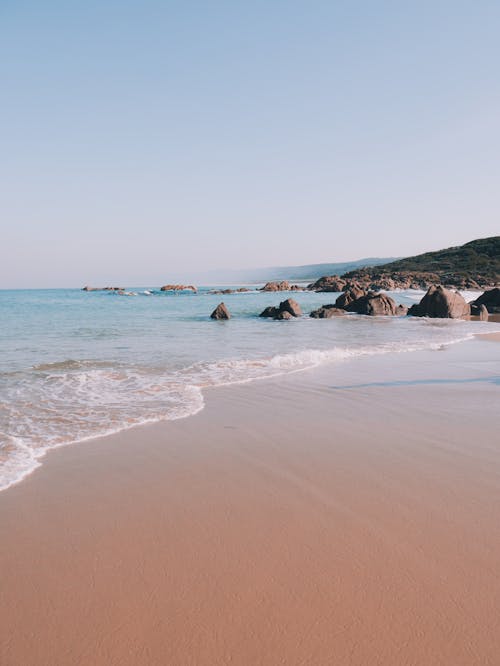 Free Soft Wavs Kissing the Shore Stock Photo