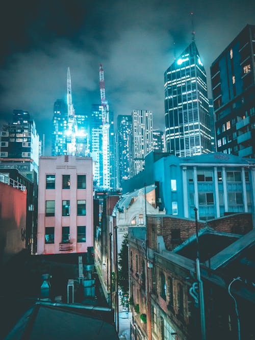 Free Street Between Buildings at Nigh Time Stock Photo