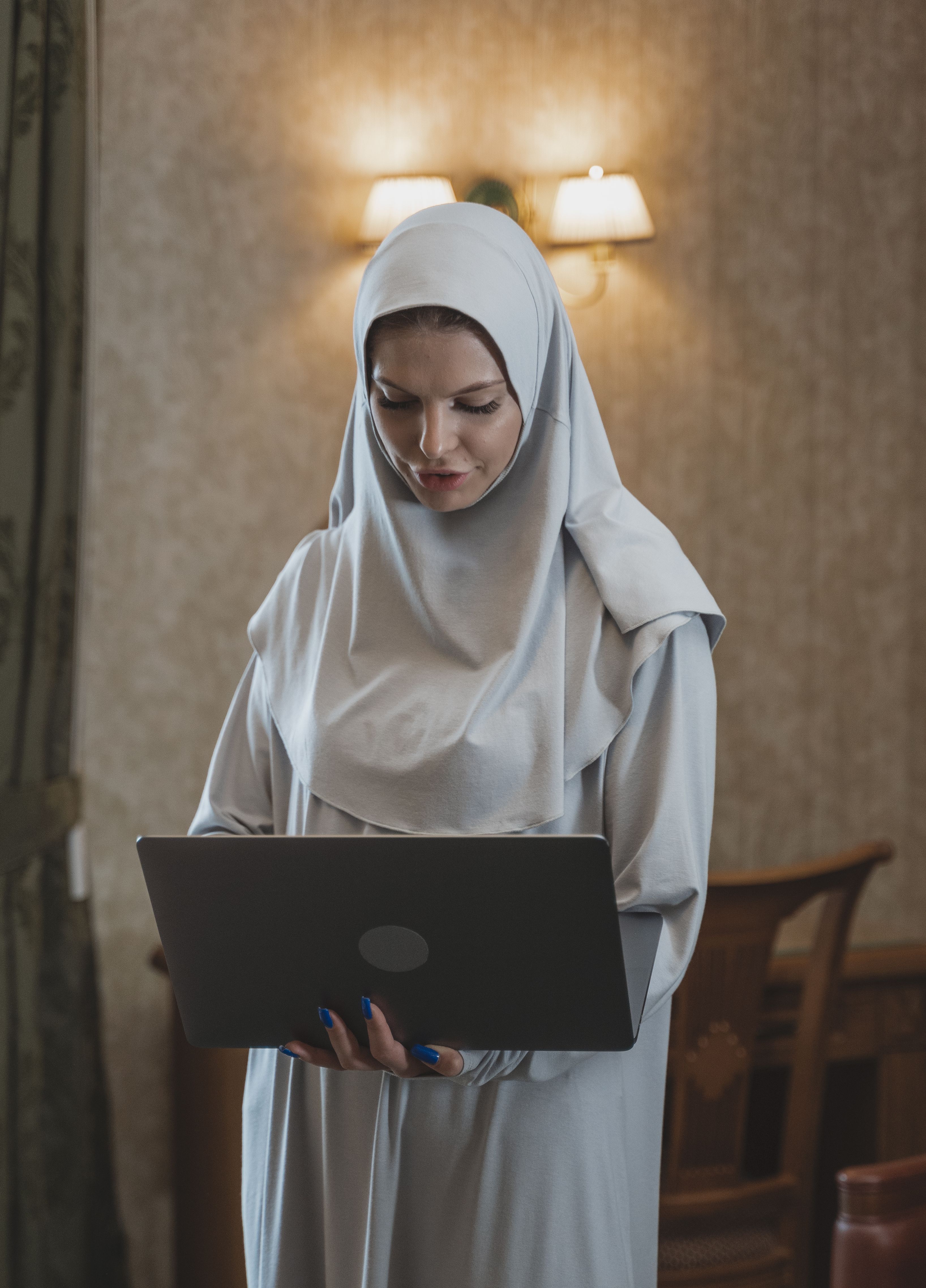 Woman in White Hijab Using Laptop Computer · Free Stock Photo