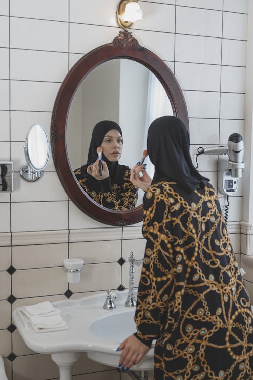 A Woman Putting Makeup On 